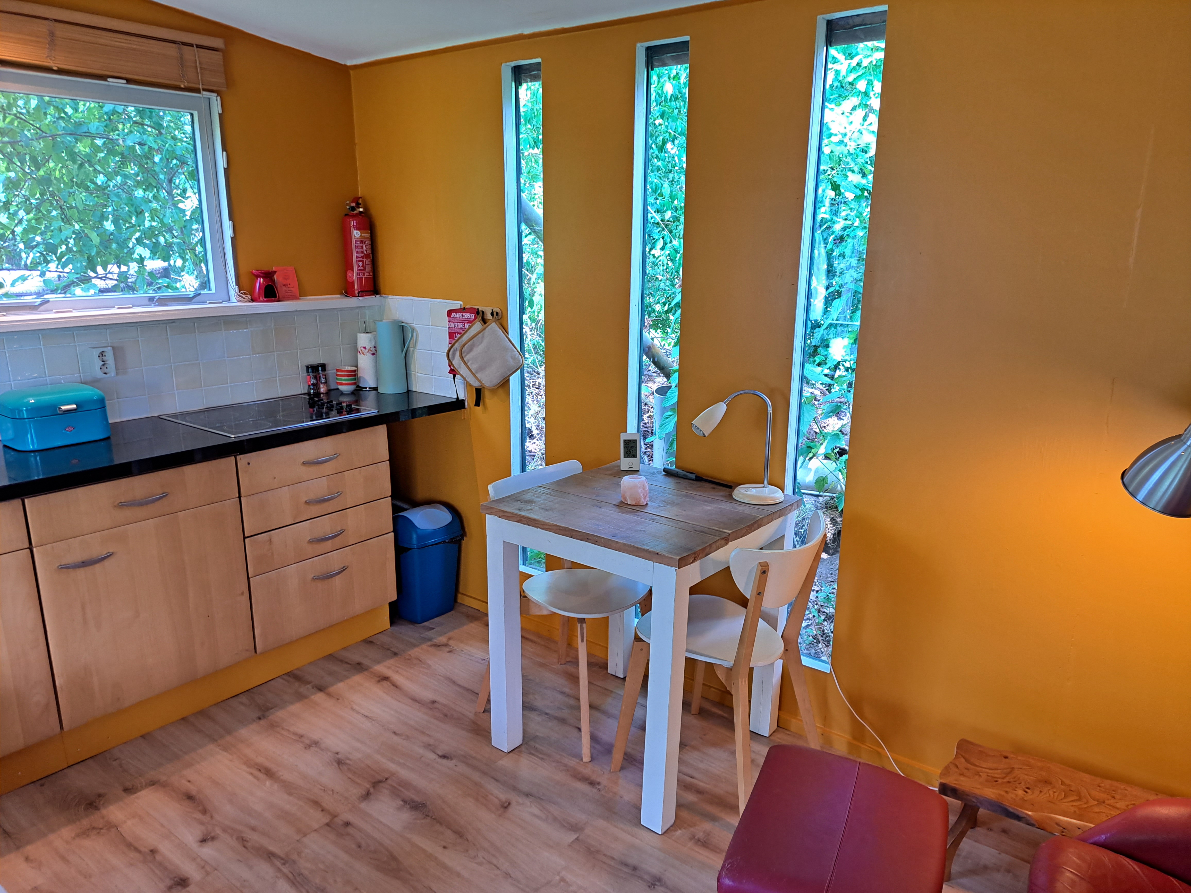 A green cup of a coffee on a wooden table